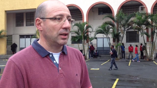 Padre cobra resolução para crise de haitianos que vão para SP