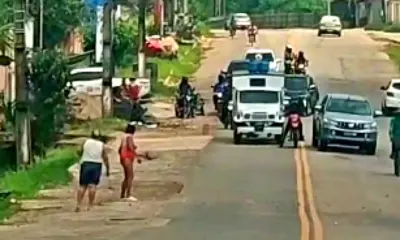 Mulher filmada jogando pedras em veículos é levada para o Hosmac