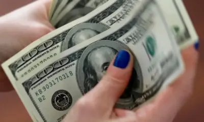 Dólar cai para R$ 5,60, e bolsa fecha em máxima histórica